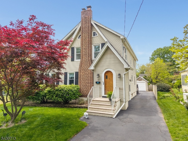 Classic Charm Meets Modern Comfort in the Heart of Cranford! This meticulously maintained home blends timeless character with thoughtful updates throughout. From the moment you enter the welcoming foyer, you'll appreciate gleaming hardwood floors, rich wood trim, original hardware, crown moldings, and freshly painted interiors.The living room features a wood-burning fireplace and flows seamlessly into a sun-filled home office through a stunning custom doorway. The updated kitchen offers ample cabinetry, generous counter space, and a center island for casual dining, all open to the dining area perfect for entertaining. A spacious rec room and cozy family room provide flexible living, with easy access to the deck and backyard.Upstairs offers three bedrooms and a full hall bath with tub/shower. The primary suite serves as a private retreat with its own full bath and stall shower. The finished basement adds valuable bonus space, complete with a half bath and laundry ideal for a gym, playroom, or office.Enjoy outdoor living on the large, low-maintenance deck overlooking a level yard, perfect for gatherings or relaxing. A one-car garage adds convenience and storage. Located on a friendly street just moments from Cranford's vibrant downtown, NJ Transit, and local parks, this home offers charm, space, and an unbeatable location.Home Warranty is included for added peace of mind move right in and enjoy! Plus -FULL day Kindergarden will be starting in this sending district !!!!