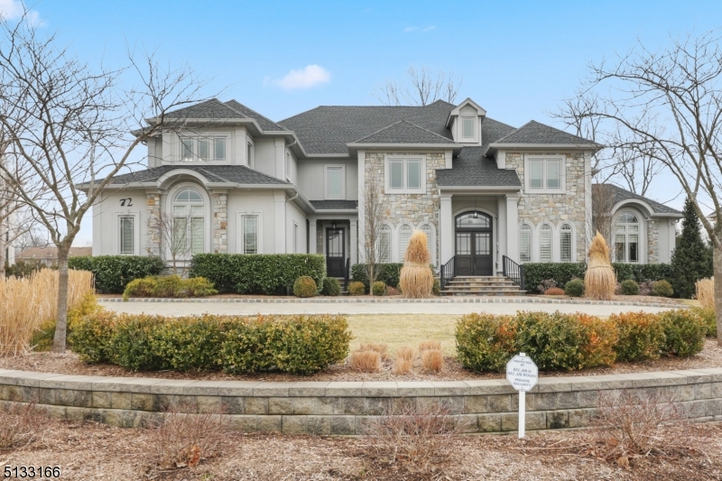 Be the second owner of this immaculate home in the exclusive Bel Air Woods neighborhood of Livingston. Enter the double front doors into a welcoming two-story marble Foyer flanked by a banquet-sized Dining Room and stylized Music Room.  Beyond, the open 1st floor offers a beautiful, high-end Kitchen - any chef's dream - adjacent to a sun-filled Breakfast Room open to the fabulous Great Room with 18-foot ceilings, and Sitting Room with wet bar. The Study on the 1st floor offers great flexibility for a Home Office/Den.  Upstairs finds a private Master Suite with a Sitting Room, 2 walk-in custom fitted closets and a luxury Master Bath. 3 additional bedrooms each with en suite baths, plus a Laundry Room, round out the sprawling 2nd floor. The lower level, accessed by the front circular staircase, back staircase or three-story elevator, is expansive and provides many options for living space.  With 2 Bedrooms with en suite baths, a large Rec Room and wet bar, an Exercise Room (pre-wired for the option of a home theater), a 1,000-bottle wine cellar and a walk-out rear patio, this space with 9-foot ceilings offers the additional flexibility for an in-law/au pair suite. The back of the home spills out to a private backyard oasis. The upper Bluestone terrace has an outdoor kitchen, gas firepit and two choices for al fresco dining and entertaining. Then it's just steps down to the expertly manicured gardens, stone fireplace, 50' pool and hot tub.   This home is not to be missed!