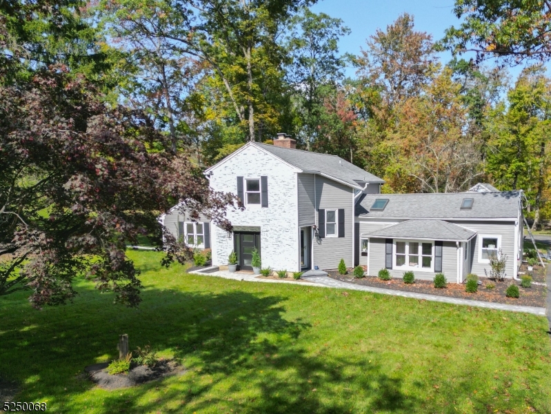 Perfect-Perfect-Perfect! Beautiful, renovated, custom 3 Bedroom, 2.1 Bath home on a private, over one-acre setting on Chester-Mendham border- 20 mins to Morristown-23 mins to train. AND LOW TAXES!! Enter thru one of the two front doors into the foyer.  You'll love the updated chef's kitchen with marble counters, center island w wine refrigerator, Smeg 6 burner professional stove, Miele double oven and Miele refrigerator. First floor Primary en suite with walk in closet, sitting room (that can be converted to another full closet or even nursery), and a bathroom with walk in shower with skylight, Toto commode and dressing area.  The Great Room has a wood-burning fireplace, beam ceilings and wet bar.  Large Living & Dining Rooms, powder rm and Laundry rm complete the first floor.  On the second floor you will find a loft overlooking the downstairs Living Room, two large bedrooms, one with a walk-in closet and another full bathroom Gorgeous hardwood flooring and tons of recessed lighting throughout. Abundance of windows and sliders that lead out to an entertaining-sized patio overlooking an expansive backyard. New vinyl siding,   new soft water filtration, new A/C installed, new kitchen, new bathrooms and new paver patio and walkway. Minutes from fine dining, shopping and blue-ribbon schools.