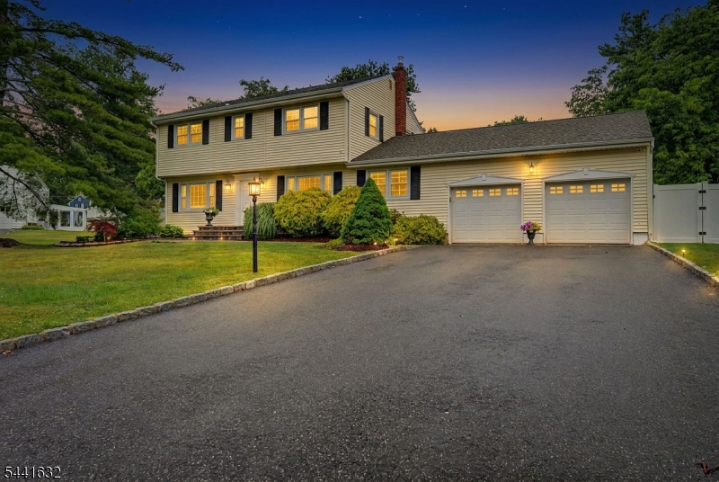 Welcome to this beautifully updated home offering an exceptional combination of quality craftsmanship, thoughtful upgrades, & resort style outdoor living. The heart of the home is the custom renovated kitchen featuring rich cherry cabinetry, granite countertops, a large center island, travertine and onyx backsplash, under cabinet LED lighting, KitchenAid refrigerator and Bosch dishwasher. Hardwood flooring, custom millwork, updated interior doors, iron balusters, and fresh interior paint create a warm and elegant atmosphere.  All baths have been tastefully updated with quality cabinetry & faucets. Major mechanicals improvements including a GAF Timberline roof replacement, Lennox furnace, Central Air. The finished basement expands the living space with recessed LED lighting & lush carpet. Step outside to your private backyard retreat. The oversized 25' x 52' gunite heated in ground pool is the center focal point for your outdoor experience. The large level yard offers professional landscaping, stunning specimen perennials, gorgeous colors, stamped concrete patio and paver walkways. The sunroom is a standout feature. Completely renovated with Italian marble flooring, multiple large Anderson windows letting the natural sun in, a newly added Andersen sliding door complete with woodburning fireplace is sure to become your favorite place to be. Located in a wonderful neighborhood within walking distance to Troy Hills Elementary School & access to major highways for commuting.
