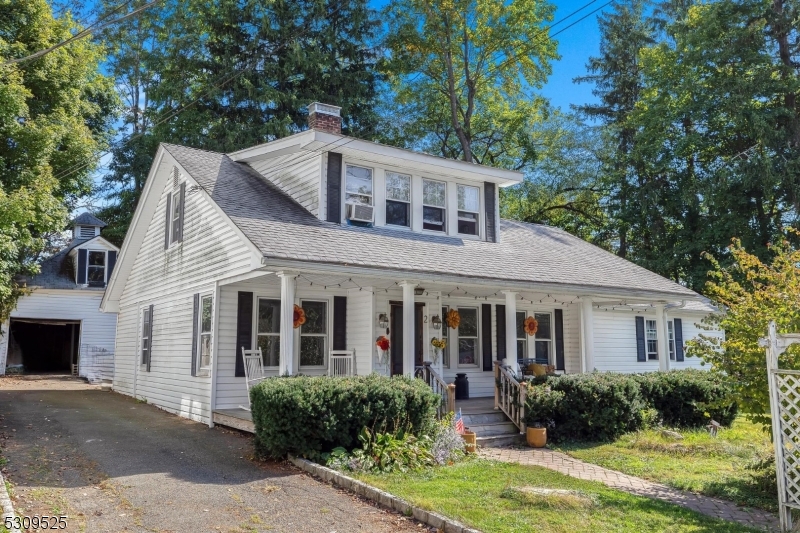Adorable Cape Cod with mahogany rocking chair front porch needs a little TLC to bring it back to it's fullest potential!  As you step inside the antique glass door, you're greeted by beamed ceilings and stone fireplace flanked by built-in bookshelves.  Hardwood floors carry through living and dining rooms, kitchen with breakfast bar is open to den/family room.  First floor in-law suite or primary bedroom with full bath completes the first floor. Upstairs features two bedrooms plus office and full bath. Unfinished basement, detached garage with full loft storage and large, level usable yard.  Newer natural gas boiler.  Great Mt. Olive system, minutes to Rt. 80.  Home and garage being sold as-is with all known defects disclosed in seller disclosure statement.