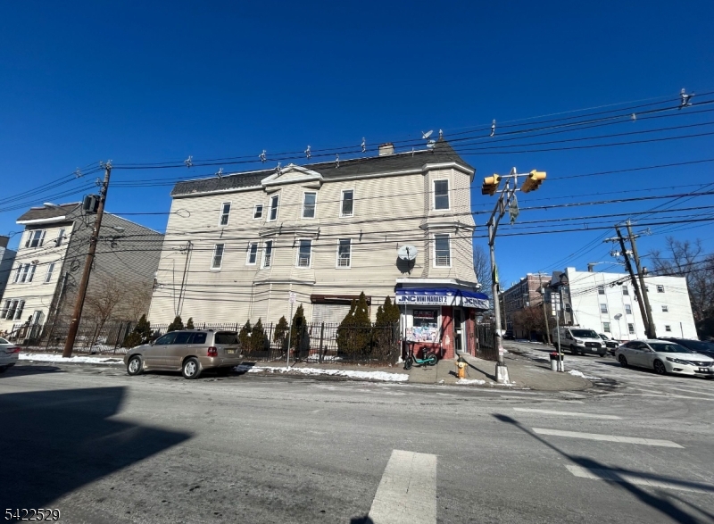 Mixed-use investment opportunity featuring a well-located property comprised of four residential units and a ground-floor commercial space. The commercial unit is currently occupied by a convenience store, providing steady income, while one of the four residential apartments is leased with additional upside through lease-up of the remaining units. The property also includes a detached garage and private driveway, offering valuable off-street parking for tenants or additional rental potential. Ideal for investors seeking a value-add opportunity with existing income and strong future cash flow potential. Lease income details available upon request. Property is being sold in strictly "as-is, where-is  condition. Buyer is responsible for independently verifying all information, including but not limited to the number of bedrooms, square footage, legal use of the property, zoning, and any applicable permits or approvals. Seller makes no representations or warranties as to the accuracy of any property details.