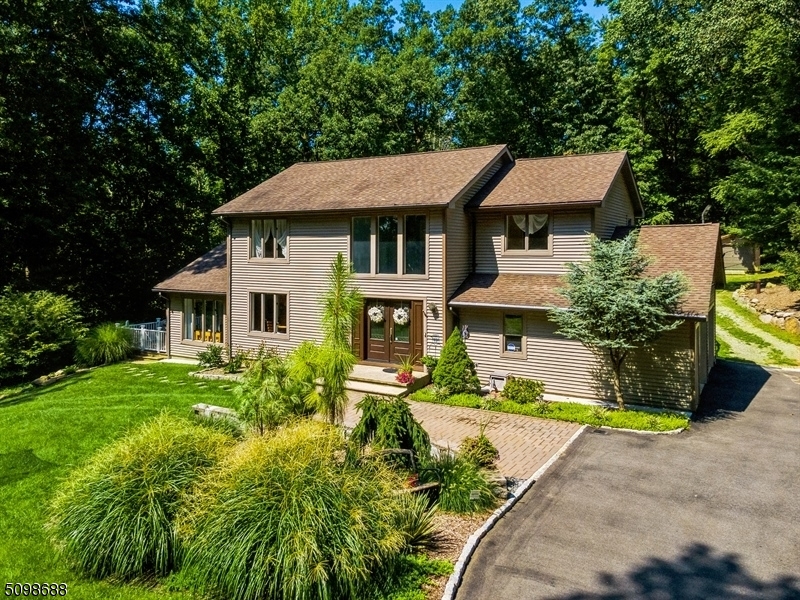 Contemporary Colonial w/4 bed&2.5bath.Attached 2car garage+1car detached+wide driveway.Nestled on 2.5acre private lot.Features hardwood floors, trim&crown molding,finished basement,& backyard oasis. Bright 2story foyer w/quarter-turn staircase.Gourmet kitchen w/granite counters, stainless steel appliances, shaker cabinetry,&breakfast nook.Banquet-sized formal dining room flows to cozy living room. Family room w/vaulted ceiling,picture window,sliding glass doors to wraparound deck.Powder Room,laundry room&garage entrance complete the 1st floor. 2nd floor has primary bedroom w/walk-in closet&bath.3 bedrooms&full bath in hallway.Finished BSMT has soundproof recreation/media space w/built-in bar&custom lighted ceiling+space for office/storage.Fire pit on patio,large above-ground pool in the fenced-in backyard.