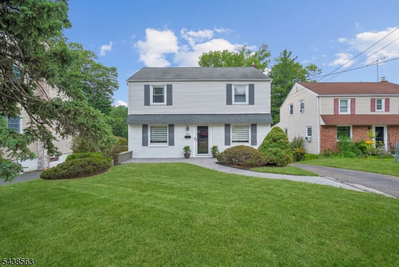 Welcome to this charming 4-bedroom, 2-full-bath Center Hall Colonial nestled in the highly sought-after St. Cloud neighborhood of West Orange. The heart of the home is the stunning newly renovated kitchen (2023) and an open flow to the formal dining room. Just off the kitchen, you'll find access to a spacious deck overlooking the large, flat backyard perfect for outdoor dining, entertaining, or relaxing. The spacious living room and inviting family room w/FP provide plenty of space for everyday living and gatherings. Natural sunlight fills the home through large windows, creating a bright and welcoming atmosphere throughout. Additional highlights include a whole-house generator and ample storage. Ideally situated, this home offers the best of suburban living with easy access to NYC transportation, including a bus stop at the end of the street. Enjoy an abundance of nearby recreation and amenities, including Turtle Back Zoo, the South Mountain Recreation Complex, South Mountain Reservation, parks, golf courses, walking trails, shopping, and a variety of dining options.
