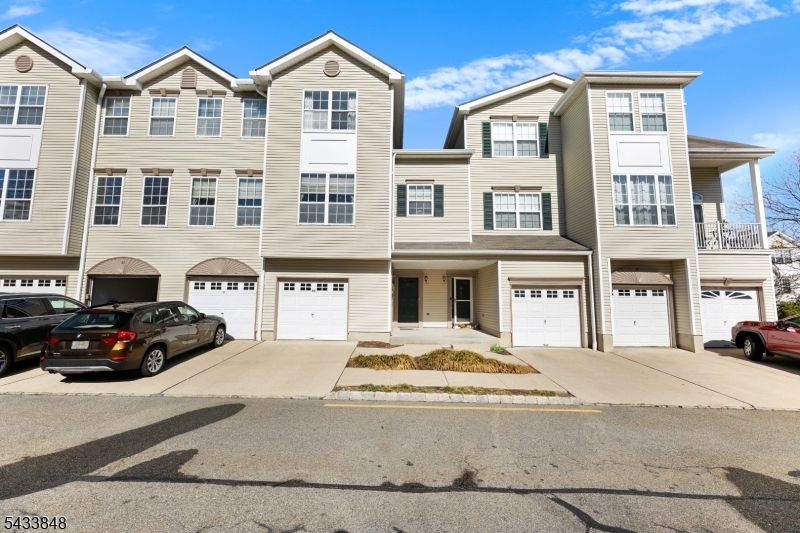 Located in one of the most sought-after areas of Morristown, this beautifully maintained 3-level townhouse offers the perfect blend of comfort, space, and convenience. Featuring 3 bedrooms, 2.5 baths, and an attached garage, this home is designed for modern living. The second level showcases beautiful wood flooring throughout the main living areas, while the third level offers a combination of laminate flooring and carpeting for added warmth and comfort. A custom oversized closet/bonus/storage room with direct access from the primary bedroom provides exceptional flexibility for a home office, playroom, or additional storage space. The spacious primary suite features a large full bath complete with a soaking tub and separate shower, creating a relaxing private retreat. Two additional generously sized bedrooms and a main full bath complete the upper level. Ideally located just minutes from downtown Morristown, enjoy easy access to authentic restaurants, shopping, entertainment, and convenient transportation options. A wonderful opportunity to enjoy townhouse living in a prime location!
