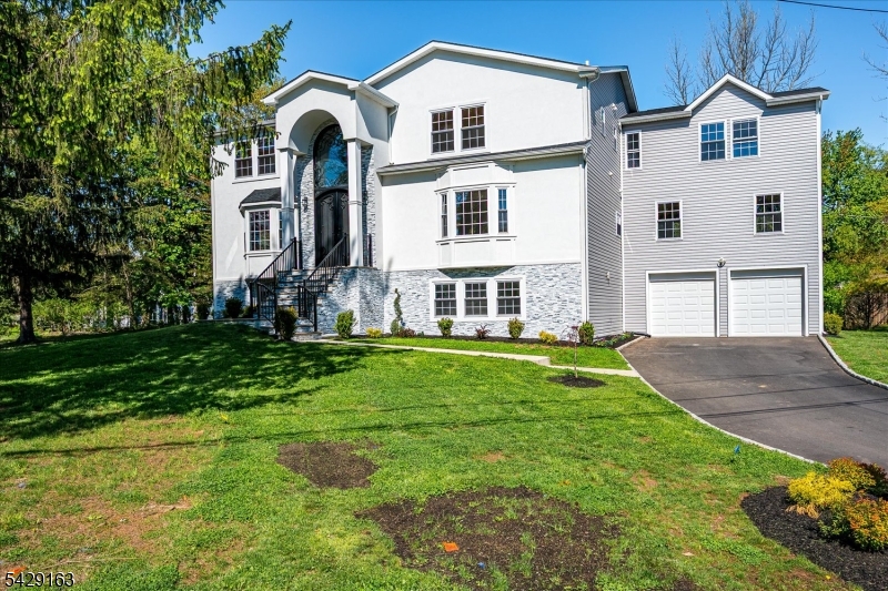 Constructed in 2025 this luxury residence is thoughtfully designed for living in one of Edison's most premier neighborhoods. Situated on a desirable corner lot, this home offers 7 bedrooms and 6.5 bathrooms, including 3 private ensuites. This home comes with a bedroom on the main level. The fully finished walkout basement mirrors this versatility with an additional bedroom and full bath ideal for recreation, entertaining. This home has 2 laundry areas. At the entrance, you are greeted with grand 18-foot foyer, setting a striking tone of scale and elegance, complemented by 9-foot ceilings throughout that enhance the home's open, airy feel. The heart of the home is a sprawling, light-filled kitchen, masterfully designed to accommodate large gatherings and seamless day-to-day living. With abundant ventilation and generous space, it is perfectly suited for those who value both function and refined entertaining. Every detail of this residence has been curated to meet the expectations of discerning buyers seeking both luxury and practicality. The walkout basement opens directly to the backyard, creating a seamless indoor-outdoor lifestyle rarely found at this level. This is more than just a home, it's a statement of comfort, scale, and modern elegance, ideally positioned within a highly sought-after community known for its convenience, prestige, and accessibility.