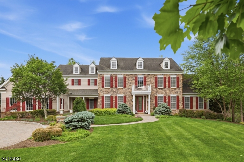 Elegant center hall colonial with Hardy Plank and stone exterior affords a luxurious lifestyle, while offering all the comforts of home.  Part of Long Valley, close to Black Oak Country Club, minutes to quaint downtown Chester, a short ride to the NJ Transit train station in Gladstone, highly rated Washington Twp. schools and West Morris Central High School, state and local parks, trails and more, this is absolutely the perfect place to call home!  Originally the model home for The Estates at Long Valley, this Coventry Manor model features all of the upgrades offered by Toll Bros. during construction.  From tray ceilings, soaring cathedral ceilings and high ceilings to extensive moldings and landscape, chef's delight cherry and granite kitchen with commercial appliances, light and bright spacious conservatory, two staircases, home office, playroom, sunroom, all bedrooms have ensuite bathrooms, walk-in attic for storage, 3 car garage, outdoor patios and entertaining spaces with built-in grill, paver circular driveway with pillar entrance and walks, fully fenced yard, walk-out basement, tiered koi pond and more, this home is truly one of a kind.  This home affords privacy with town land behind and having 6 acres of wooded property.  The PERFECT place to call home! **New 1st floor central air in 2026.