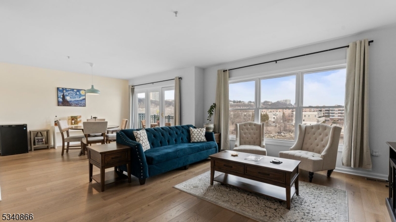 SELLER IS OFFERING A SPECIAL ASSESSMENT BUYER CREDIT! Situated in the heart of Edgewater, New Jersey, The Promenade! Just look at these breath-taking, unobstructed New York City Views over The Hudson River. This Stunning 2 Bedroom, 2 Bathroom Condo Home boasts approximately 1500 Square Feet including Open Concept Entertaining Options and an Outdoor Balcony that are sure to impress!  Location at its best! City Place at The Promenade is the place to be. Featuring an abundance of restaurants, shops, boutiques, and self-care services are only steps away from home.  The Promenade is the perfect blend of endless options in a Private Community.  The Promenade is a Prestigious Gated Community with 24 Hour Security, Assigned Parking, and Elevator Access to all Building Entrances and Walking Paths.  Resort-like Amenities Include a Private Community Room, Fitness Center, Sauna, Jacuzzi, and Locker Rooms.  Seller is motivated, please present ALL OFFERS!