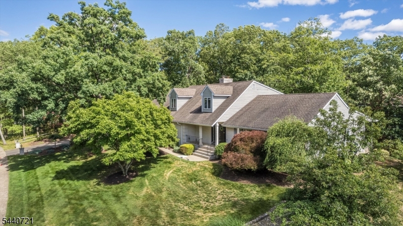 Welcome to this exceptional five-bedroom custom Trailwood home located in the Cedar Knolls section of highly sought-after Hanover Township, known for its low taxes & top-rated schools. This spacious residence features a gourmet kitchen designed for both everyday living & entertaining, complete with two ovens, stainless steel appliances, a large center island with prep sink & built-in microwave, a pantry, and abundant recessed lighting. The flexible floor plan includes a first-floor primary suite, an additional generously sized first-floor bedroom, recently renovated bathroom with a Carrara marble counter top, porcelain tile floor & Harrow smart bidet. Enjoy multiple living spaces, including a welcoming family room, formal living and dining rooms, a first-floor office & a convenient laundry room. Second level features three bedrooms, bathroom & office. Fully finished basement with a great room, powder room, and an additional versatile room. Two decks,  three-car garage.  Residents of Hanover Township enjoy access to outstanding community amenities, including a beautiful township pool (membership fee required), community center, before- and after-school programs, numerous youth sports leagues, and several parks throughout the township. Commuters will appreciate the convenient proximity to the Morris Plains Train Station, offering Midtown Direct service to New York City. Minutes from downtown Morristown, where you'll find an array of vibrant dining, shopping, and entertainment.