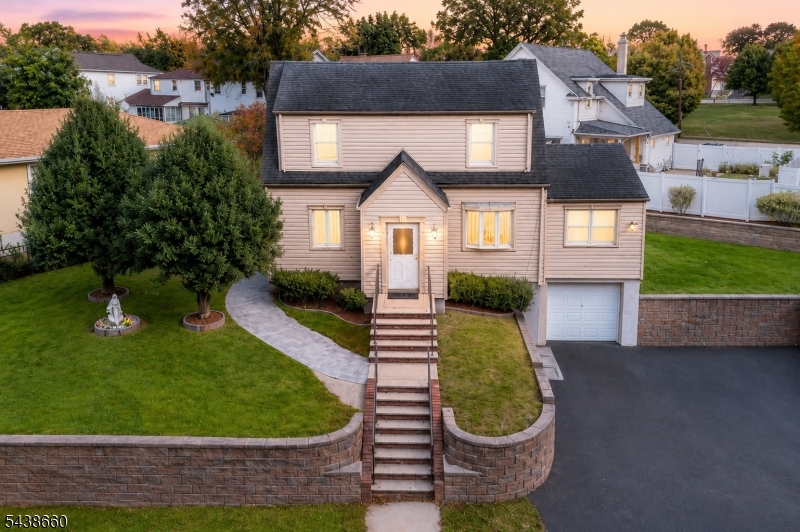 Experience this full of character home situated in Kearny's sought-after Manor section, steps from Manor and Sansone Parks, with westerly views of the Passaic River. The first floor features a large Family Room, Dining Room, updated Eat-in Kitchen, and a spacious Bedroom that can also serve as an Office. Upstairs are Two generous Bedrooms with Hardwood Floors, ample closet space, and a Full Bath. The Finished Basement offers a Recreation room, Half Bath, and access to the attached Garage. Enjoy Central Air, an extra wide Driveway, a custom back Patio, and a storage Shed. Conveniently located just 10 miles from Midtown Manhattan with easy NYC Bus and Train access. Come make this home yours before someone else does!