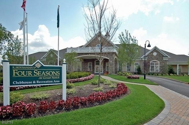 Enjoy maintenance free living in this amazing end unit town home in one of the most sought after communities This Magnolia model end unit has everything that you have been looking for. With direct access from the private garage there is no need to worry about stairs or long walks from the car. This one floor unit features an open floor plan with hardwood floors throughout the living areas and Master bedroom. The spacious master bedroom has a walk in closet, and full bathroom with a double vanity, tub, and walk in shower.The kitchen has granite counter tops, a large bay window and pantry. The formal dining room is open to the large liven space that has access to your own private deck. Don't miss a chance to live in this resort style community with a wide array of amenities and social activities.