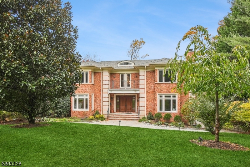 Sited in the prestigious Fairfield section of Short Hills, this stunning custom home blends timeless architecture with modern sophistication. Soaring 9-foot ceilings, gleaming hardwood floors, and exquisite millwork set a tone of effortless elegance throughout. With six spacious bedrooms, five full and two half baths, and beautifully proportioned living areas, every space feels both luxurious and welcoming. Thoughtful details abound gas and wood-burning fireplaces, radiant-heated baths, refined lighting, and a built-in sound system add warmth and comfort to daily living. Kohler generator, four-zone heating and cooling ensure year-round ease. Step outside to expansive bluestone terraces overlooking a large heated pool, surrounded by manicured grounds and graceful stone walls perfect for entertaining or quiet relaxation. The serene primary suite offers a private retreat with a dressing room, walk-in closet, and beautifully designed bath. The walk-out lower level features an additional bedroom, pool bath, playroom, gym, and generous storage. Additional highlights include a three-car garage with dumbwaiter, paver driveway, and large cedar closet. Enjoy top-rated Millburn schools, nearby shopping, parks, and easy NYC access an exceptional lifestyle in one of New Jersey's most desirable neighborhoods.