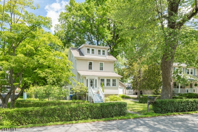 COLONIAL CHARMER WITH PICTURESQUE FLAT LOT OFFERS EASY ACCESS TO TRAIN, SHOPS, DINING, HIGHWAYS & MORE! There's more than meets the eye at 37 Fox Hill, tucked just off Rte 53, across the street from a playground & under .5 mile to Mt Tabor & Denville train stations. Enclosed front porch serves as convenient entry foyer next to bright Sun Room with inviting views of front yard. Period moldings & refinished hardwood floors flow from the Living Room into the sunny formal Dining Room w/ plenty of space for family gatherings. Recently upgraded Kitchen boasts granite countertops, gray cabinetry, dishwasher & newer Fisher & Paykel fridge. But the real surprise comes when you step from the Kitchen into the 2026 addition on heated tile floors to discover 2 huge double-door pantry closets, built-in mudroom cubbies & access to a small side deck leading to a charming patio beneath a gorgeous magnolia tree. Amazing flat fenced-in Backyard extends straight back offering perfect space for play, gardening & more. Addition also features Office with built-in desk & shelves, Laundry closet & modern Full Bath w/ subway-tiled walk-in shower. Upstairs you'll find 2 Bedrooms with corner windows & ceiling fans plus a Full Bath with tub/shower combo. Third Level is a secret hideaway among the treetops, with a 3rd Bedroom highlighted by large dormer windows out front & a deep closet w/ added storage space off the hallway. Basement is unfinished & versatile. Don't miss this one!