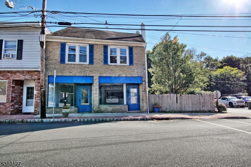 GREAT OPPORTUNITY!!! Prime mixed-use property offering both income potential and convenience. This building features two spacious storefronts at street level, ideal for retail, office, or service businesses, each with large display windows that provide excellent visibility. The two spaces are presently open to one, but can easily be closed off for two separate stores. (town variance is required) Above the commercial space is a private apartment, perfect for an owner-occupant seeking live/work flexibility or as a rental unit for additional income. The apartment features 3 bedrooms (3rd is attic level) with its own entrance. The side yard is private and perfect for outdoor leisure. Four parking spots are assigned to the building .Don't miss this rare opportunity. PUBLIC WATER, PUBLIC SEWER & GAS LINE IN THE STREET!