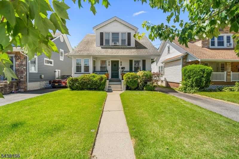 Welcome home to this beautifully renovated 3 bedroom 1.5 bath Colonial nestled on a quiet road! Boasting exceptional curb appeal, you are greeted by a charming front porch and mature landscaping. Step inside to find gorgeous hardwood floors flowing throughout the main level. The heart of the home is the brand new gourmet kitchen, complete with a breakfast bar, rich butcher block countertops, stainless steel appliances, and a coveted walk in pantry. A flexible first floor bonus room makes the perfect home office or recreational space. Upstairs features three bright bedrooms and a beautifully updated main bath. The fully permitted, partially finished lower level adds incredible value, offering a spacious recreation room, a brand new half bath, dedicated laundry space, and ample storage. Major mechanical upgrades include a high efficiency 2-in-1 instant hot water and heating system. Outside, enjoy an expansive driveway with parking for 5 cars, a 2 car detached garage, and a deep private backyard perfect for entertaining. Turnkey and packed with upgrades this gem won't last!