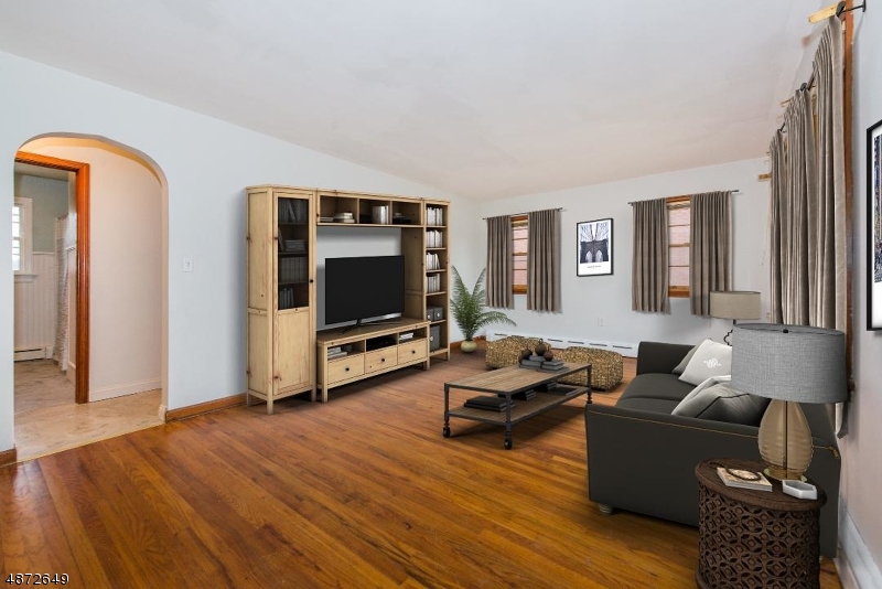 This well maintained nicely updated home has much to offer. A light and bright living room, hardwood floors throughout, eat in kitchen with access to the large level backyard. The walk up attic has endless possibilities, from master suite, rec or game room. the choice would be yours.