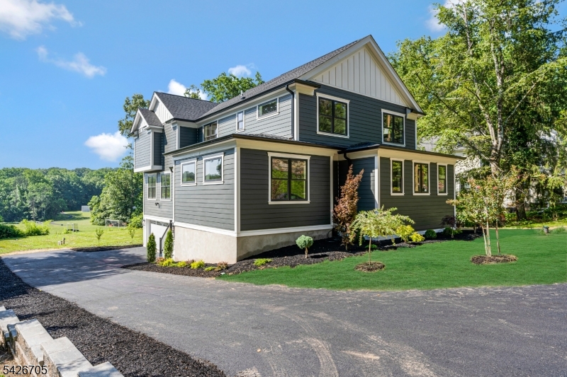 Experience the perfect blend of timeless farmhouse charm and contemporary luxury in this exceptional new construction home. Thoughtfully designed with comfort, style, and functionality in mind, this stunning residence offers 4 bedrooms and 4.1 baths and not to be missed. The open-concept floor plan is filled with natural light from walls of windows and features a spacious living room with a gas f/p flowing seamlessly into the gourmet kitchen. Designed for entertaining, the kitchen boasts quartz countertops,center island with seating, 2 apron sinks, premium SS appliances, abundant cabinetry, open shelving, a walk-in pantry, and a coffee bar. A cozy nook off the kitchen provides the perfect space for casual dining, office, or play area.The elegant DR showcases custom millwork and an amazing gathering space. Upstairs, the luxurious primary suite features a vaulted shiplap ceiling, walk-in closet, and spa-inspired bath with dual vanity, an oversized shower, and private water closet. 3 add'l bedrooms include one ensuite and two sharing a hall bath, plus a 2nd fl laundry room. The LL offers a rec room, full bath, and ample storage. Exterior highlights include Hardie Plank siding, professional landscaping, and modern architectural details. Ideally located in Bernardsville with easy access to major highways, NJ Transit rail service to NYC, and Newark Liberty International Airport. This move-in-ready home offers exceptional craftsmanship, designer finishes, and an unbeatable location.