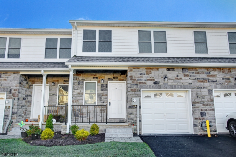 Bright and spacious unit with hardwood floors downstairs, carpeted upstairs. Stainless and granite in kitchen. Private deck in back overlooking woods. Professional photos coming, you will not be disappointed