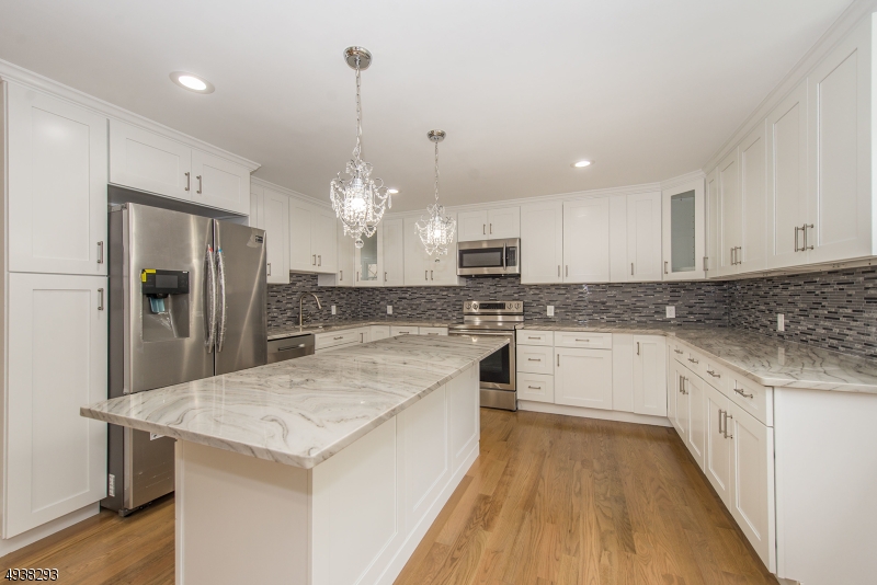 PRICE REDUCED FOR A QUICK SALE! Move in just in time to celebrate the holidays! A quality renovation with PUBLIC SEWER! This home has an amazing custom kitchen featuring granite countertops, a very large island, brand new stainless steel appliances and plenty of cabinet space.  It is much bigger than it seems from the outside and no expense has been spared!! Come experience the spacious kitchen, dining room, living room, family room and 4 bedrooms alongside 3 beautifully renovated full bathrooms, wood crown moldings throughout, and tons of natural light.  There is plenty of storage space as well in addition to an open backyard space with a large deck for entertaining. BRAND NEW ROOF & BRAND NEW CENTRAL AIR SYSTEM. Hurry before it's too late!