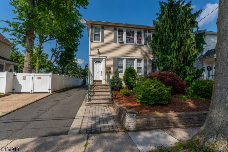 Fantastic Multi-Family Opportunity in Rahway! Located just a few blocks from the Rahway Train Station, this well-maintained multi-family home offers the perfect combination of owner-occupancy potential and investment opportunity. With 4 bedrooms, 3 full bathrooms, separate utilities, and a flexible layout, this property is ideal for homeowners looking to offset expenses with rental income or investors seeking a strong addition to their portfolio. The first-floor unit features a spacious living room, formal dining room, eat-in kitchen, two comfortable bedrooms, and a full bathroom. The second-floor unit offers a similar layout with a living room, dining room, eat-in kitchen, two bedrooms, a full bathroom, and an additional office space perfect for working from home or extra storage. The partially finished basement includes a family room, full bathroom, separate entrance, laundry area, and ample storage space, providing additional versatility and potential. Outside, you'll find a detached garage with an attached storage room, a long driveway offering plenty of off-street parking, and a spacious backyard perfect for entertaining, gardening, or relaxing outdoors. Conveniently located near downtown Rahway, shopping, restaurants, parks, major highways, and public transportation, this property presents an excellent opportunity to own, occupy, and collect rental income or expand your investment portfolio in a desirable commuter-friendly location.