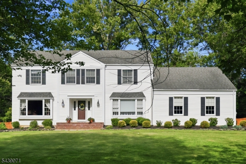 Welcome to this beautifully maintained 4 bedroom, 2.5 bath colonial set on a lush 1.8+ acres in the highly sought-after Highview Estates.The property boasts outstanding curb appeal that embraces abundant landscaping throughout the oversized level lot, and a spacious deck to enjoy the outdoors.The main level includes an elegant formal dining room with hardwood floors. The spacious kitchen is illuminated by natural light that showcases the bright cabinetry, granite countertops, and stainless steel appliances.The cozy family room offers a wood burning fireplace and hardwood floors that open to sliders to the deck. Upstairs, the spacious primary bedroom includes a walk in closet and private en suite. There are 3 additional bedrooms, flexible for a variety of needs.Recent updates include new central air conditioning(2025) and new hot water heater(2025). This is great opportunity to be located within the highly-regarded West Morris school district. Conveniently located near shopping, dining, and major commuting routes.