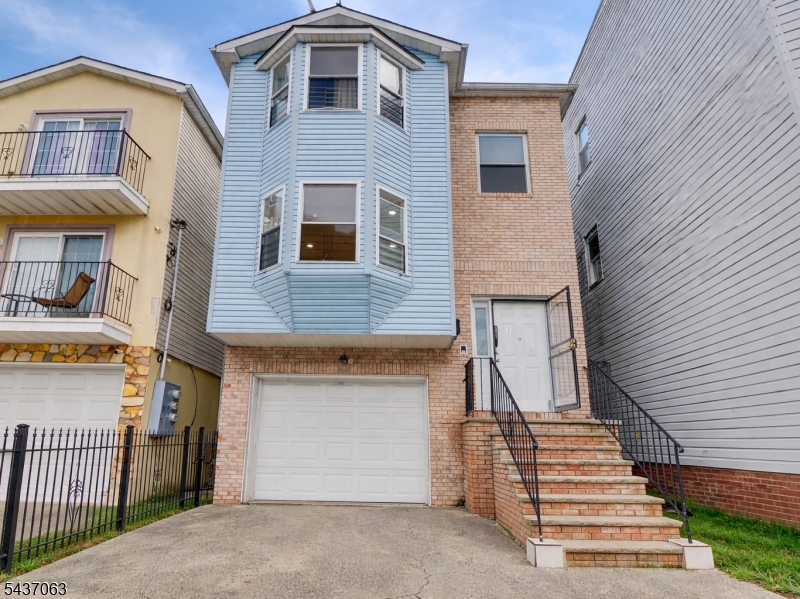 Newly renovated 3-bedroom, 2-bath residence offering a primary ensuite, walk-in closets, recessed lighting, central heating, and central air conditioning. The home features a living room/dining room combination with hardwood floors throughout. Property is conveniently located near Newark Penn Station, major transportation options, and places of worship.