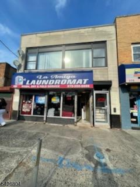 Well situated Commercial 4A 2 storey building consisting of 1,800 total s.f suitable for laundromat (plumbed for current use) or hair salon, with updated office (2025), full bathroom and kitchenette above. In the heart of the thriving Roseville section with lots of high visibility and foot traffic.. Second floor currently used as a trendy architect's office. . Office rent $2,500. Laundromat has 10 year lease at $2,000 per month with annual 6% increases.