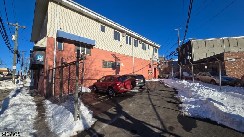 Great Investment Opportunity with Dedicated Parking lot, approx. $140K annual income, featuring a maintenance free property with 8 units mix-use property consisting of 4 newer 2 bedrooms 2nd floor residential units in great condition, built approx. 1995 with modern/open layouts, LR, Kitchens, 2 spacious bedrooms and bath, all separate utilities and gas baseboard heat (RENTS are under Mkt Value and currently M2M at $1200 EACH), the ground floor consists of 4 shops (Unit#1 currently for rent at $2,000 a month consisting of approx 2000SQF formerly used as an upholstery shop with overhead 12'  door), Unit#2:  a Karate/Gym with office and 2nd floor room with restrooms rented at $1650, Unit#3: Tire-Shop currently $1,280, and Unit#4 Auto Repair $1680.  Property is very well maintained and in good condition consisting of 2 lots (384-386 River St - Parking for tenants, and 386-390 River St ).This building is very well-maintained, in a convenient location of Paterson, close to shopping, NYC transp.and major highways.