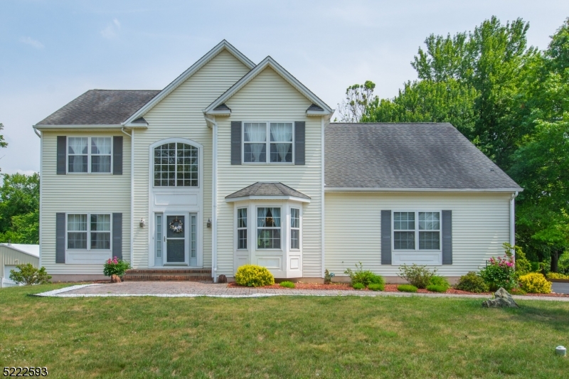 This spacious Colonial has 4 bedrooms, 3 full baths and another room which could be used as an office or a 5th bedroom. Home is complete with HW floors throughout main level, large 2 car garage, central air, moldings and much more. Beautiful master bedroom with 2 walk-in closets and a sizable full bath. This home is perfect for entertaining with an open floor plan and sliders leading to deck which overlooks large backyard. Great location in a peaceful neighborhood and minutes away from all shopping, restaurants, and entertainment you could ask for.