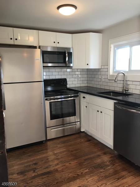 Fully Renovated 2018!  Open concept 2 Bedroom, 1 Bath w Ofc/Spare room. Gorgeous Hardwood floors, Remodeled Kitchen w SS Appliances, Granite, Updated Bath. Great downtown location. Won't last! Historic charm meets modern convenience. The reno retained original features including Skylights, Beamed ceiling and walls while totally remodeling the Kitchen and Full Bath to modern standards. New Carpet in Large Bedrooms. New efficient Electrical throughout.