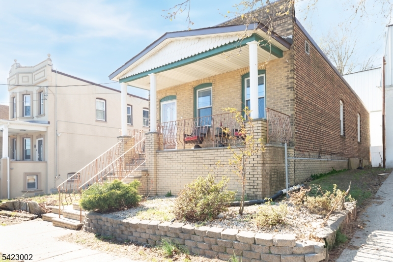 Great Opportunity to get your new home for less than the cost of a rental! This charming, beautifully decorated and renovated solid brick 2 bedroom 2 full bath ranch home with high ceilings, located on the north side of town. Close proximity to major highways like GS Parkway, Rt 440, Outerbridge crossing, Rt 9, as well as, the Woodbridge downtown and train station. This move-in ready home features a picture-perfect covered front sitting porch with storage underneath. Inside, formal living room with electric fireplace, good sized formal dining room and large updated eat-in kitchen with recessed lighting, white shaker cabinets, butcher block countertops, white subway tile backsplash, stainless steel appliances, including French door refrigerator, gas range/oven and countertop microwave. 2 large bedrooms and main bathroom on the first floor. Partially finished basement with recessed lighting includes 3 bonus rooms, 2nd full bathroom, plus laundry and utility rooms and still plenty of room for storage. Central air and forced hot air. Out back, enjoy relaxing in the private fenced-in low maintenance backyard with a nice-sized deck.