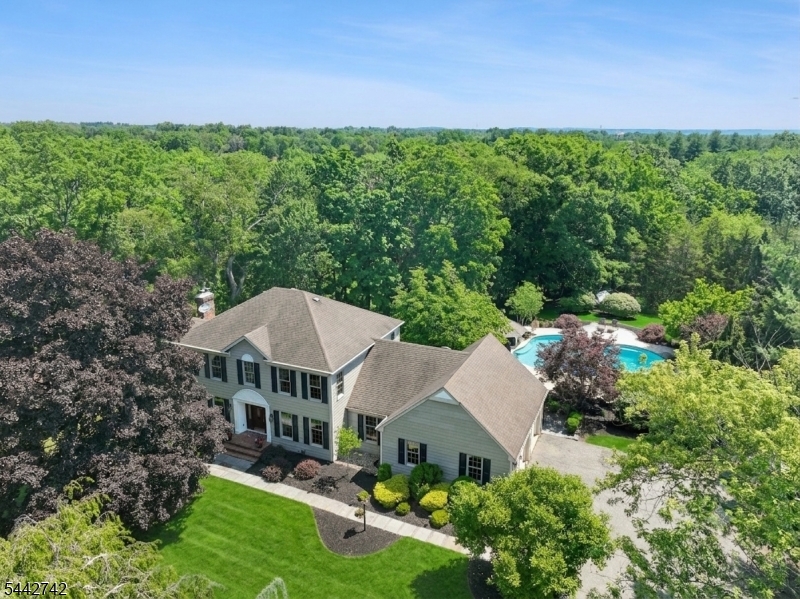 Welcome to your own private oasis just 48 miles west of NYC.  Set on 3.5 breathtaking acres and offering serenity, privacy, and an exceptional lifestyle . On a quiet cul-de-sac, this impressive home combines luxury living with an extraordinary outdoor retreat.  Designed for entertaining on a grand scale, the spectacular backyard is truly one-of-a-kind. The owner, who owns a well-known pool company, custom designed the elaborate high-end pool complex featuring a stunning waterfall, relaxing hot tub, charming gazebo with bar, and expansive two-tier Ipe wood deck. The property extends all the way back to scenic Chambers Brook stream, creating a peaceful and picturesque setting.  Hardwood flooring flows throughout both levels. The remodeled kitchen has granite countertops, stainless steel appliances and abundant cabinetry. The family room features a cozy fireplace with brick surround.  A versatile first-floor home office, located adjacent to a fully remodeled bathroom, offers the potential for first-floor bedroom. Spacious bedrooms have generous closet space.  The walkout finished lower level expands the living space with a recreation room, exercise room, and large storage room. Additional highlights include a whole-house backup generator for added peace of mind.  Conveniently located near NYC train service, major highways, shopping, and restaurants, this exceptional property offers the perfect blend of luxury, privacy, tranquility, and convenience.