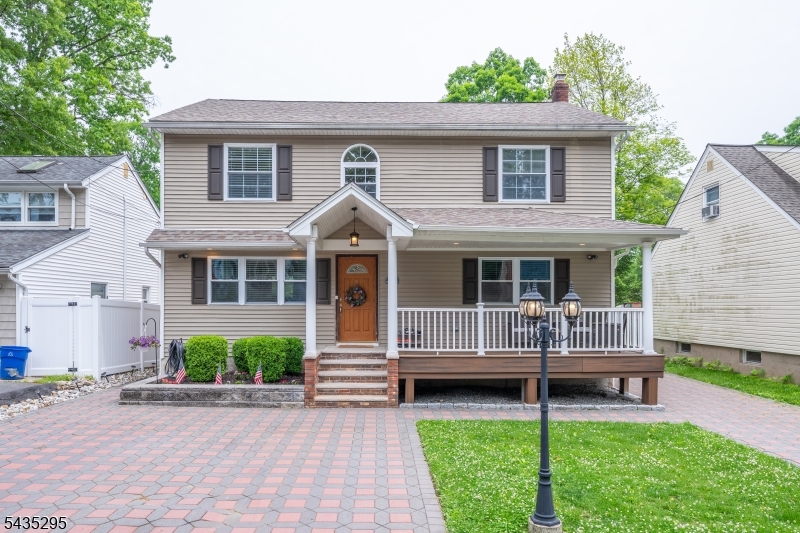 Welcome home to this impeccably updated Colonial, where timeless architectural character seamlessly blends with a sleek, modern open layout. Designed for effortless daily living and entertaining, the main level boasts gleaming hardwood floors and sun drenched spaces. The heart of the home is the stunning kitchen, with beautiful granite countertops, stainless steel appliances, and a layout that flows naturally into the main living areas. Retreat upstairs to the serene primary suite, featuring a luxurious, beautifully tiled en-suite bath. Downstairs, the spectacular finished basement offers incredible bonus living space perfect for a home theater, gym, or playroom. Step outside to your private backyard, where a spacious deck overlooks a fully fenced yard, offering the perfect backdrop for summer barbecues and peaceful relaxation. From the gorgeous paver driveway to the pristine tiled baths and turnkey finishes throughout, this home leaves absolutely nothing to do but move right in!