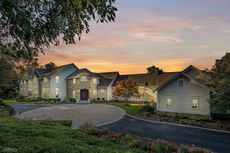 First time on the market! This stunning 6 en-suite bedroom residence is poised atop Bernardsville Mountain. Encompassing 5+ rolling, landscaped acres, the gated estate offers luxurious living. Grand foyer, spacious floorplan with soaring ceilings, hardwood floors & detailed moldings prevail throughout the light-filled interior of this sophisticated home. Oversized designer kitchen with 2-islands, pantry & top-of-the-line appliances. The spacious master suite creates a sense of peace w/ fireplace, gorgeous bath & 2 walk-in closets. The bright finished w/o lower level provides exercise, game & family room. The meticulously landscaped property includes a pool w/ spa, outdoor kitchen, blue stone patios, secret garden & historic stone walls making this an ideal home for relaxing & entertaining. 4-car garage
