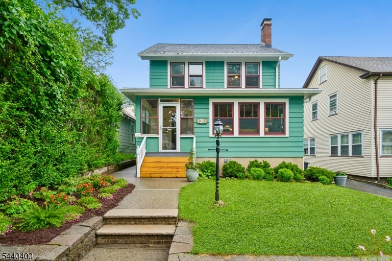 Classic 1930's character meets meaningful updates in this 4 bedroom, 1 bath Colonial offering 1,560 sq ft of living space, right next to Eagle Rock Reservation. Amazing NYC skyline views from the den and front steps add a memorable daily backdrop, while a welcoming screened front porch leads into the living room with added wood beams and molding plus a restored wood-burning fireplace hearth. The sunroom and formal dining room add flexible, light-filled space, and the updated kitchen includes new quartz countertops, backsplash, sink, disposal, brand-new LG refrigerator, and Bosch oven/gas range. Many newer windows throughout the home include custom Andersen windows in the living room, dining room, and sunroom. Exterior improvements include wider gutters with covers and new downspouts, cedar and Hardie Plank siding, new screen doors, rebuilt wood stairs to the backyard patio, gardens, and a 1920s-style house number sign. The dry, unfinished basement is ready for finishing, with a sump pump and French drains. Custom radiator covers, era-appropriate lighting, and a refurbished main staircase with renewed spindles and railings add thoughtful finishing touches. Outside, a paver patio and level yard provide ample space to relax & entertain. A 2-car detached garage conveys strictly as-is. Close to Whole Foods, Target, shopping in West Orange & Montclair, and the West Orange Jitney Rte 7 corridor, one block away, with service to Orange and Brick Ch. NJ Transit stations. Welcome Home!