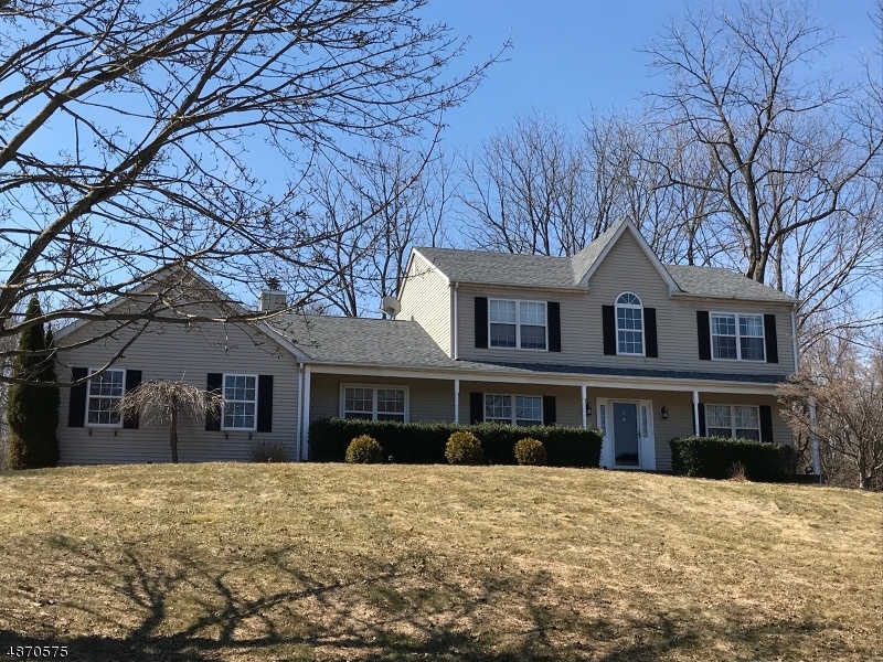 Picture perfect colonial on cul de sac in lovely neighborhood. Welcoming front porch with views opens to 2stry foyer. Open concept formal living & dining rm. Huge kitchen with center island for impromptu meals plus adjacent casual dining area.  Family rm w/vaulted ceiling, brick fplc and wood floor. 4 Bdrms include one on the 1st flr currently used as an office.  The MBR has walk-in closet, attached full BA w/new shower stall.  An added bonus is the finished basement w/dry bar. Entertaining's breeze when you access the expansive deck from French drs off the fam rm or sliders from the kitchen. Great Storage - Pull down stairs to attic in garage & 2nd flr hallway plus unfin space in bsmnt; new roof; Less than 10min from Rts 80/46/31 and approx 7.5 mi from Hackettstown's eclectic dining & craft brew scene.