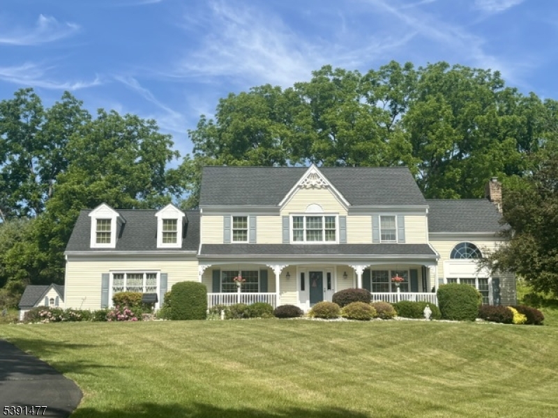 A warm and welcoming home, you will delight in this lovely Rolling Hills colonial that has been lovingly maintained and updated by original Owners. Open floor plan, sunken Family Room with cathedral ceiling and beautiful brick hearth, gas FP, and French doors that open to a 4-season sunroom with mahogany floor, cathedral ceiling and French doors to composite deck. Hardwood floors throughout 1st floor, 1st Floor laundry/mudroom with entry to yard. The chef's kitchen boasts a double pantry, granite countertops & newer SS appliances. Rocking chair porch in front. Updated baths including higher 17" toilets. Upstairs you will find 4 very generously sized bedrooms, including a Primary retreat with cathedral ceiling boasts a Juliet balcony overlooking the Family Room.  Additionally, 2 walk-in closets, a private bath with soaking Jacuzzi tub and stall shower as well as an adjacent sitting room ideal for use as an office, hobby room, gym, etc.  Main bath with double vanities.  Ample closet space throughout. Generac generator, updated electric and radon system in place. New roof in 2023!  ADT security system and Ring doorbells. 2 car garage with automatic openers, plus large storage shed. All appliances & Home Warranty included! Just waiting for its next chapter. Come & See!