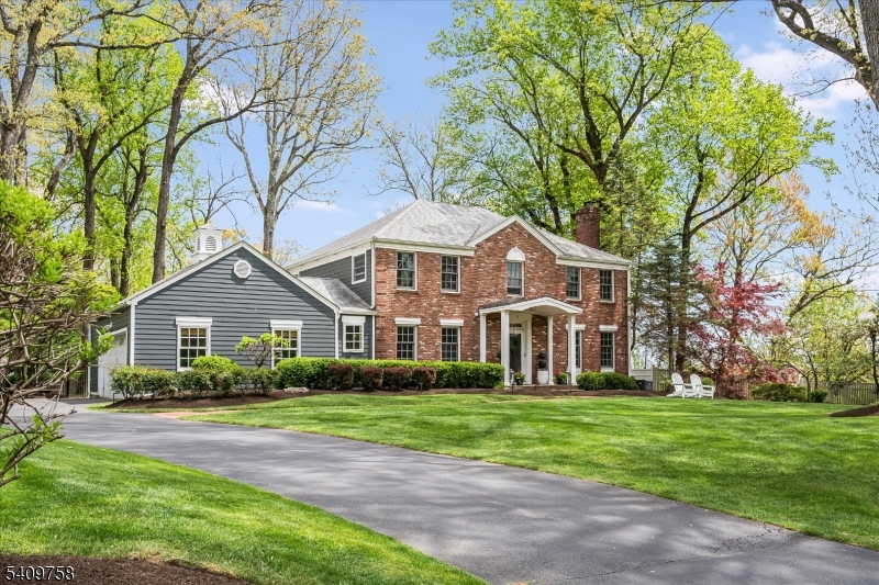 Nestled on a level 0.62-acre lot in one of Chatham's most sought-after neighborhoods, this updated 5-bedroom, 2 full and 2 half bath Colonial offers space, style, and modern convenience. Sun-filled interiors feature an updated kitchen with a Wolf range and Viking refrigerator, along with a beautifully renovated primary bath. A finished basement adds flexible living space for recreation, work, or entertaining. Outside, the expansive backyard is designed for gathering, complete with a bluestone patio and striking outdoor fireplace. Additional highlights include a whole-house Generac generator, EV charger, and numerous recent upgrades throughout. Located in the highly regarded School District of The Chathams, this move-in ready home combines comfort, function, and a prime location.