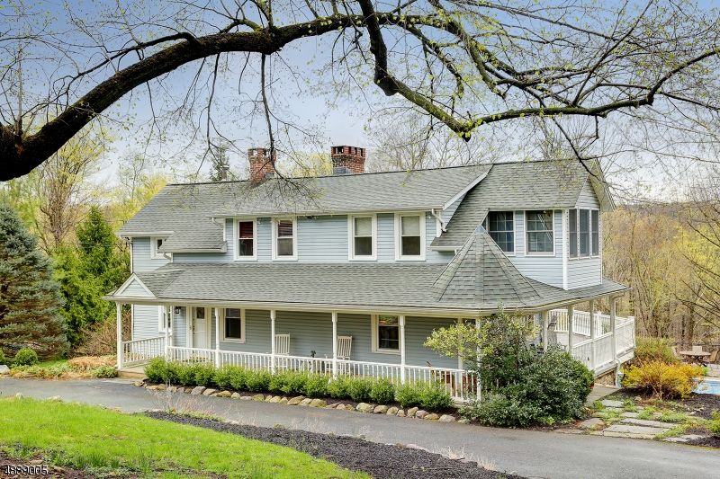 Beautiful serene bucolic setting,Set back off road with circular driveway. Historic charm and character with the convenience of modern updates with pastoral landscaped grounds with relaxing in ground pool, plus spacious wrap around porch and deck. Step into foyer and the beauty and charm begins! 2 Fireplaces, hardwood floors, An addition shows off a large updated kitchen with French doors leading to deck. Separate large dining room enhances the entertaining flow. Upstairs Master suite features a vaulted ceiling with Master Bath and walk in closet. 3 other bedrooms plus sun porch continue to add to the character of this home. All this plus a legal In Law suite on the ground level, spacious with lots of light, offering bedroom, bath, kitchen and living room plus separate entrance. So much to love in this home!