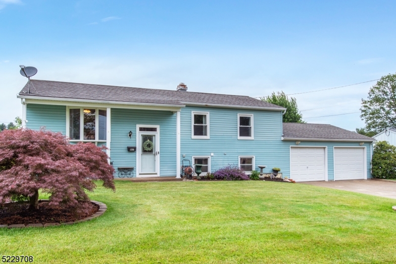 Hurry, this 3 bedroom, 1.5 bath corner lot property will not last! This home primarily features a large dining room, updated main bath, large master with huge walk in closet, HW floors on main floor, updated windows, central air, oversized two car garage with plenty of additional parking, public utilities, natural gas and more! 3 season sun room leads out to patio and flat backyard with garden and massive shed for storage.