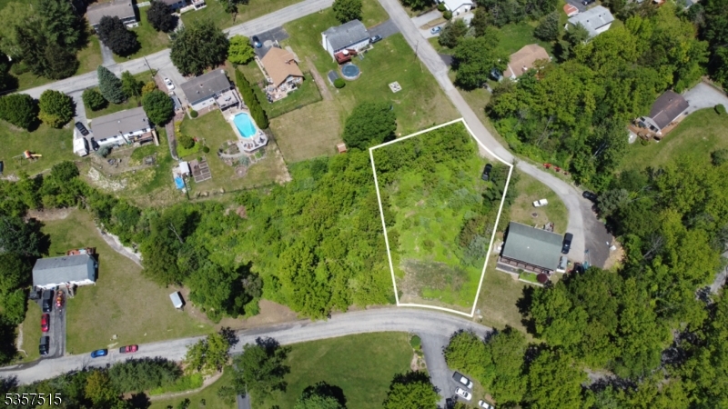 This exceptional lot is build ready. It is located in the highly sought-after private lake community of Vernon Valley Lake, offers breathtaking mountain views and a prime location just minutes from top-rated schools, shopping, and local amenities. Members and their guests enjoy exclusive access to a 26-acre lake ideal for swimming, boating, fishing, ice skating, and picnicking all in a tranquil, conservation-focused setting that supports local wildlife and enhances property values. The lot includes an installed 2-bedroom septic system and is approved for a 3-bedroom upgrade, streamlining your custom build process. Detailed architectural and engineering plans are also provided, saving you time and effort. Whether you're envisioning a cozy retreat or a spacious family home, this opportunity allows you to start building without delays. With its peaceful surroundings, recreational perks, and close proximity to essential services, this is a rare chance to create your ideal living space in one of the area's most desirable communities.