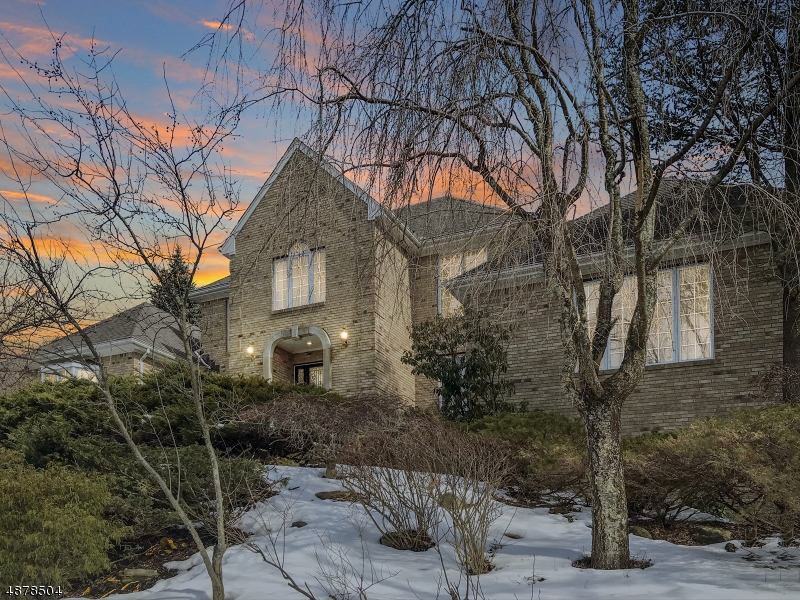 Welcome to this Grand Colonial, Custom Built home in Denville's desirable Paramount Estates, just 30 miles west of NYC.  Two story center hall with Carrera marble floors & open staircase. Enjoy entertaining and cooking in the fully equipped, newly renovated kitchen featuring 9 foot Quartz center island, chef-grade 5 foot dual fuel Wolf Stove, and Sub-Zero Fridge. Features a spacious floor plan with in-law suite w/ full bath on main floor, hardwood floors throughout and 2 fireplaces. All 5 bedrooms have walk-in closets. Ample storage with two attic spaces and a large walk-out basement. Oversized 3 car garage w/ additional storage room.  Private tiered landscaped grounds w/gazebo, concrete patio, waterfall, walking paths & mountain views!  Taxes lowered as of 8/2019. A stunning well maintained home!
