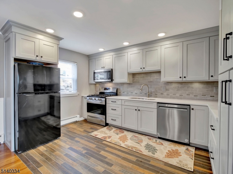 THIS IS NOT YOUR TYPICAL MOUNTAIN CLUB CONDO!  WHY PAY RENT WHEN YOU CAN BUY THIS BEAUTIFULLY-RENOVATED, 1ST FLOOR, 1 BEDROOM END UNIT CONDO IN A PRIME, PRIVATE BUILDING? NEWER WOOD FLOORS. SPACIOUS LIVING ROOM W/ LARGE PICTURE WINDOW. EXPANDED KITCHEN WITH HIGHER-END ALLEN & ROTH CABINETS, QUARTZ COUNTERTOPS & NEWER APPLIANCES. RECESSED LIGHTING THROUGHOUT ENTIRE CONDO.  FRESHLY PAINTED. BEDROOM HAS 2 LARGE CLOSETS. NEWER A/C UNITS IN LIVING ROOM AND BEDROOM. HEAT IS INCLUDED IN YOUR LOW MONTHLY MAINTENANCE FEE ALONG WITH WATER, SEWER, TRASH & MORE! PARKING SPOT CONVENIENTLY LOCATED DIRECTLY BEHIND UNIT. SECURED STORAGE UNIT ALONG WITH COIN-OPERATED LAUNDRY FACILITIES INCLUDED IN BUILDING. AMENITIES INCLUDE POOL, SAUNA, GYM, TENNIS COURTS AND USE OF NEWLY RENOVATED CLUB HOUSE. CLOSE TO TRAINS, MAJOR HIGHWAYS AND SHOPPING!