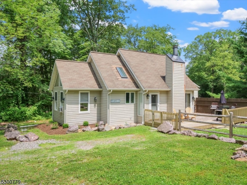 Welcome to this charming, well-maintained 1 bedroom chalet located in the highly sought-after PRIVATE Upper Greenwood Lake community that allows power boats! Are you a first-time homebuyer or are you looking to downsize? Perhaps you're in the market for a vacation home with lake access? This lovely, fenced-in, flat property set on almost half an acre of land could be your garden sanctuary. Within the past year, this home has been freshly painted, flooring has been updated, and ALL appliances have been replaced to stainless steel. High ceilings in the living room complete with skylights are the perfect recipe for a "sun-drenched, open-concept" living space. Enjoy your morning cup of coffee outside on your wrap-around deck while watching your four-legged friend chase squirrels around the yard. There's a voluntary, small annual fee for lake access which includes a beach and a club house; the boat lauch is also nearby. Close to hiking, skiing, and all that Warwick, NY has to offer in terms of farms, breweries, wineries, restaurants, and shops. This one will go fast, so schedule an appointment to see this property before it's too late!