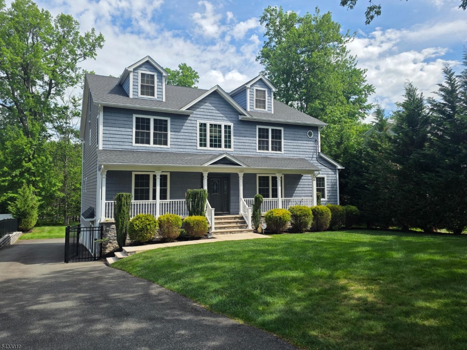 This stunning 6-bedroom, 5 full and 1 half bath Center Hall Colonial offers the perfect blend of elegance, comfort, and modern convenience. Freshly painted throughout, this spacious home features an inviting layout ideal for both everyday living and entertaining. The gourmet kitchen is equipped with stainless steel appliances and complemented by a convenient butler's pantry with a wet bar and wine refrigerator for added storage and prep space. Additional highlights include coffered ceilings, generously sized closets throughout , first floor in-law suite, an interior car charging station, a built in Generac generator and underground sprinkler system. Conveniently located close to shopping, top-rated schools, and major highways, this exceptional home offers both luxury and accessibility.