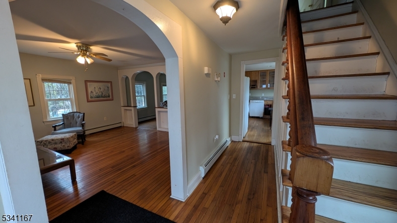 Great opportunity to infuse new love into this charming side hall colonial! Convenient location on quiet dead end street!  Big level backyard and lemonade front porch make for nice outside space! A bedroom, full bathroom, laundry area and separate walkout access to basement were a modern addition to the main floor of this older country style home.  Main floor bedroom has a vaulted ceiling with a skylight which can easily function as an office/den. 2nd full bath upstairs is large w/ a double vanity, ball & claw tub, stall shower, and closet.  3 nice size bedrooms all have original HW oak flooring.  Living room and formal dining room have nice quaint accents of a bygone era.  Sunny kitchen was updated from original with oak cabinets and granite countertops. DRY full height basement has plenty of room for workbenches! 200 amps electrical service.  No A/C.  Sheds on property for extra storage. Aluminum siding, vinyl replacement windows & roof were updated when addition was done. Natural gas and public water available on street for future conversions.  Peerless furnace is convertible.  Public sewer. Home features long-standing structural supports in basement and attic that have maintained the home's integrity for decades. Home inspection recommended. Property is being sold in as-is condition with existing structural supports to be accepted by buyer in purchase agreement. It is priced accordingly.   There will be no OH; by appt only.