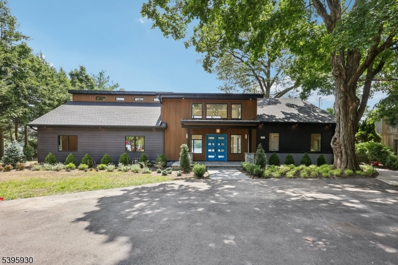Welcome to an exceptional luxury retreat in sought-after West Milford. This stunning 5-bedroom, 4.5-bath custom home offers the perfect blend of refined elegance, superior craftsmanship, and breathtaking lake views.From the moment you arrive, you'll be captivated by the home's impressive presence and meticulous attention to detail. Inside, a thoughtfully designed open-concept layout showcases soaring ceilings, rich architectural finishes, and an abundance of natural light. The gourmet chef's kitchen is a true showpiece, featuring high-end appliances, custom cabinetry, and an oversized island perfect for both everyday living and entertaining on a grand scale.The expansive living and dining areas flow seamlessly, highlighted by designer touches and panoramic views that bring the outdoors in. A luxurious primary suite offers a private sanctuary, complete with a spa-inspired bath and serene lake vistas. Each additional bedroom is generously sized, with beautifully appointed bathrooms that provide comfort and privacy. Step outside to experience resort-style living, where stunning outdoor spaces are designed to maximize the picturesque surroundings. Whether hosting gatherings or enjoying quiet mornings overlooking the water, this home delivers an unparalleled lifestyle. Perfectly positioned in a prime location, this one-of-a-kind property combines tranquility, luxury, and convenience making it a rare opportunity you won't want to miss.