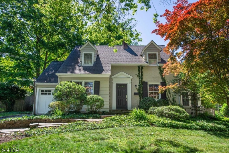 This lovely and spacious 4BR/2.5Bth Colonial embodies what every discerning Buyer seeks! Kitchen w/ Peninsula was updated in 2026 w/ Quartz counters, marble backsplash, stainless steel appliances, and Kohler fixtures. The generously-sized Living Room has a Gas Fplc and beautifully-toned hardwood flrs, extending throughout the home's 2 levels. Enjoy the 3-season Sunroom, which can double as Office, Den or Playroom. The home's expansive Family Room has built-in shelves, and opens to the sizable eat-in Kitchen area. An addition, running across the whole back of the home, adds a space, marked by natural light and an airy openness. Adjacent to the Kitchen is an elegant Dining Room, enhanced by custom picture-frame wainscoting, chair rail molding, and refined millwork details. The mudroom leads to a side entryway, providing another convenient access to the backyard. On the 2nd level, the en-suite Primary BR has a renovated Bathroom which impresses w/ its marble floors, stylish fixtures and over-sized stall shower. The home's original Primary BR is strikingly large and has a cedar closet. The fashionably renovated Main Bath services the 3 additional BRs on this floor. The Backyard, with its bluestone patio, pergola, and stone wall, is beautifully manicured w/ a great variety of plantings and shrubbery for one's outdoor entertaining and relaxation. This home bursts with old world charm while boasting newer home systems throughout. Perfect marriage of vintage and modern. Welcome Home!