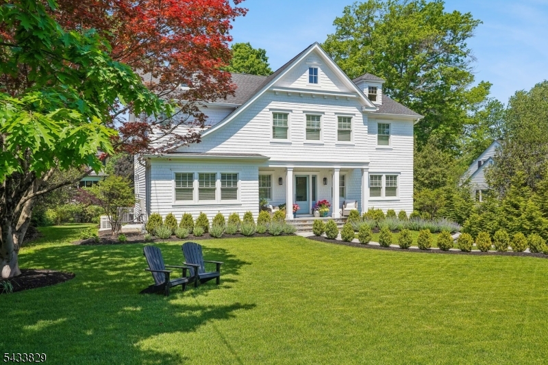 Set in the heart of Madison's sought after Hill section, this exceptional 2 year young residence built by renowned builder Will Lloyd offers the perfect blend of timeless elegance, modern luxury, and effortless living. Surrounded by mature trees and beautifully landscaped grounds, the home makes an unforgettable first impression with its striking curb appeal and sun drenched interiors enjoying a very private backyard with Trex deck. Spanning four finished levels of thoughtfully designed living space, this stunning home features 7 bedrooms and 6.1 baths, with exquisite craftsmanship and lovely architectural detail.  At the heart of the home is a white chef's kitchen with quartz countertops, a Wolf six burner oven, Sub Zero refrigerator, breakfast bar, walk in pantry, and butler's pantry. The kitchen opens to the breakfast area and family room and a dining room, living room and powder room completes this level. The second level offers five spacious ensuite bedrooms, including a luxurious primary suite with dual custom closets and a spa inspired bath with dual vanities and an oversized shower. A finished third level provides additional living space with a bedroom, full bath, office and large storage.The fully finished lower level equally impressive, features a spacious recreation room, additional bedroom, full bath, and mudroom. A rare opportunity to enjoy newer construction with exceptional quality just moments from town, schools, dining, NYC trains and international airport.