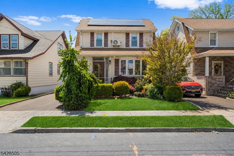 Welcome to this beautifully updated and well maintained 4-bedroom, 2.5 bath Colonial style home, offering the perfect blend of comfort, style & commuter convenience. Inside, you'll find gleaming hardwood floors & spacious rooms throughout, creating a warm & inviting atmosphere. The large 'working' kitchen is ideal for everyday living & entertaining. It features ample storage, a 5-burner stove, sleek graphite-colored appliances, granite counters & a modern glass tile backsplash.  The Open Floor Plan design provides spacious living areas that offer flexibility & seating options.  Enjoy year-round relaxation in the sunlit, enclosed front porch.  The rear yard offers your own private backyard retreat. The landscaped lot showcases an in-ground pool surrounded by elegant stone decking perfect for summer gatherings or quiet evenings at home. Owned solar panels provide energy efficiency & long-term savings (@ $178/mo.).  Temperature controlled attic offers additional finished space.  Ideally located near major roadways (Rts 1/9 & 27, NJ Turnpike, GS Parkway.) This home offers quick & easy access to NJ Transit Northeast Corridor trains and bus lines with convenient service to NYC & points South.  Minutes to Newark Liberty International Airport making travel a breeze. Close to downtown & regional shopping, notable restaurants, community offerings, Houses of Worship and Kean University.  A true move-in ready home with space, amenities, and an unbeatable location.  This one won't last!!